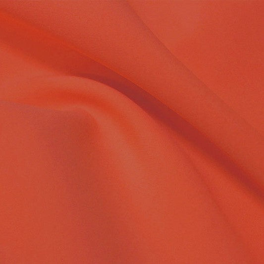A flat sample of flexfilt recycled polyester spandex in the color burnt sienna.