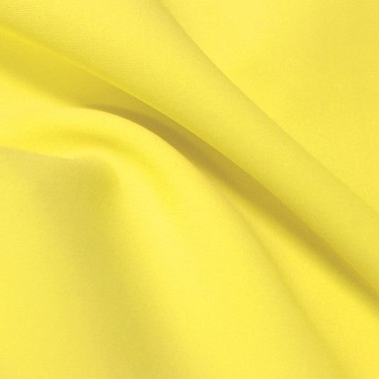A flat sample of flexfilt recycled polyester spandex in the color low key lemon.