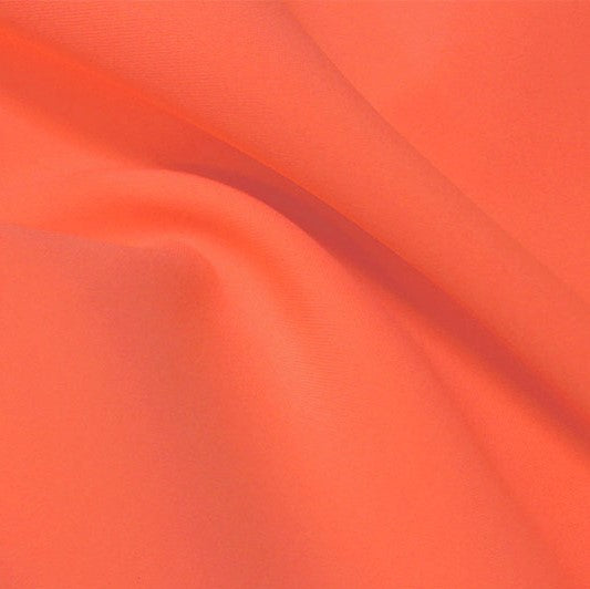 A flat sample of flexfilt recycled polyester spandex in the color peach berry.