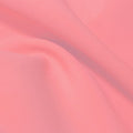 A flat sample of flexfilt recycled polyester spandex in the color pinky swear.