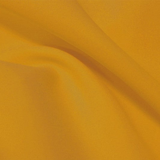 A flat sample of flexfilt recycled polyester spandex in the color saffron.