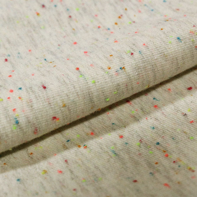 A sample of Speckle Cotton Polyester Modal Terry Spandex Fabric in the color Cream / Multi