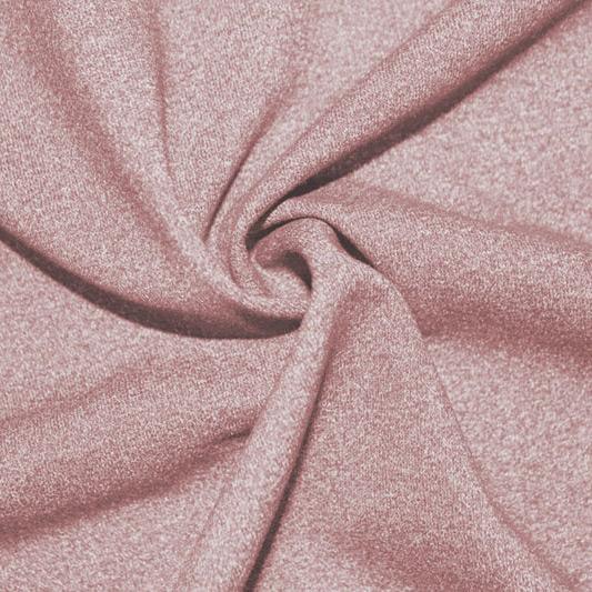 A close-up of Heather Spandex in the color rosy peach.
