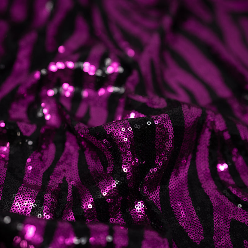 Close up detail image of Heidi Zebra Spandex Sequin in Black and Magenta.