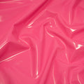 A swirled piece of polyurethane coated polyester spandex in the color Fluorescent-Pink