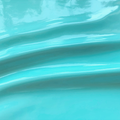 A swirled piece of polyurethane coated polyester spandex in the color mint.