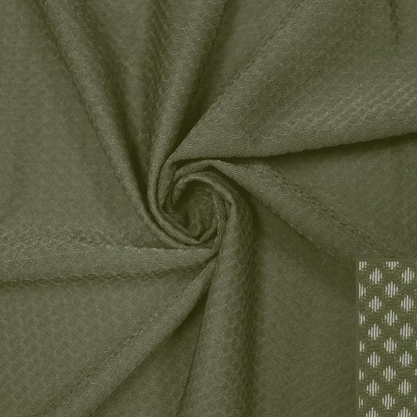 A swirled piece of Hive Textured Spandex in the color dusty olive.