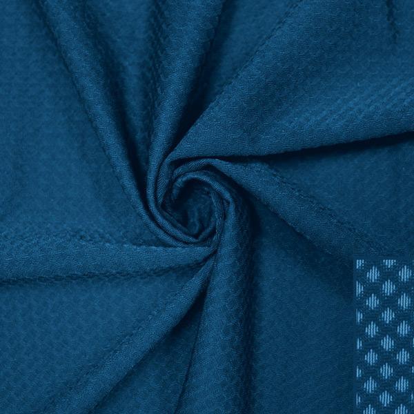 A swirled piece of Hive Textured Spandex in the color empathy.