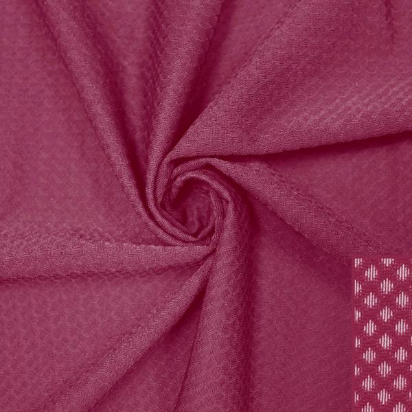 A swirled piece of Hive Textured Spandex in the color mulberry.