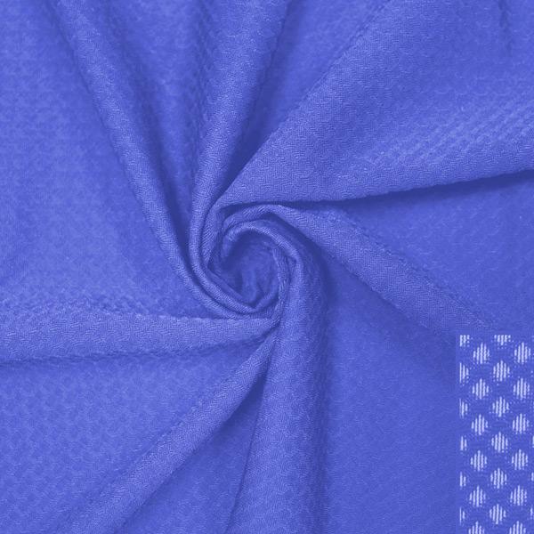 A swirled piece of Hive Textured Spandex in the color periwinkle.