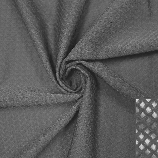 A swirled piece of Hive Textured Spandex in the color slate gray.