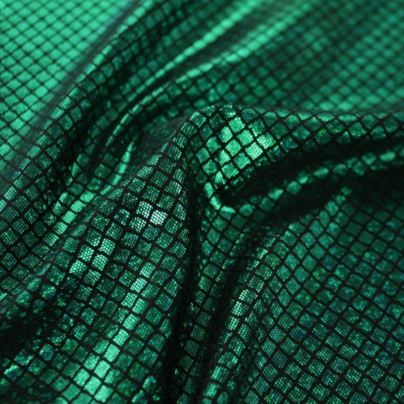 A swirled sample of illusion foil printed spandex in the color black-kelly green.