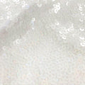 A flat sample of jazzy stretch sequin in the color white.