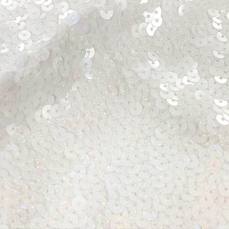 A flat sample of jazzy stretch sequin in the color white.