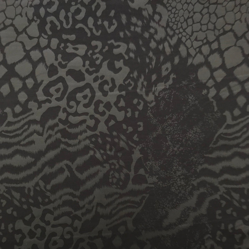 A flat sample of jungle patch foil printed superflex in the color matte black.