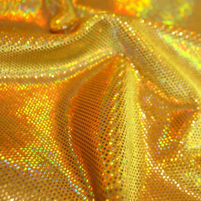 A swirled sample of legacy foiled stretch velvet in the color yellow-gold.