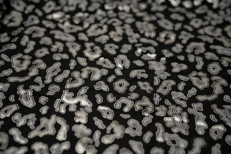 Detailed shot of Leo Party Foil Printed Spandex in color Black/Silver.