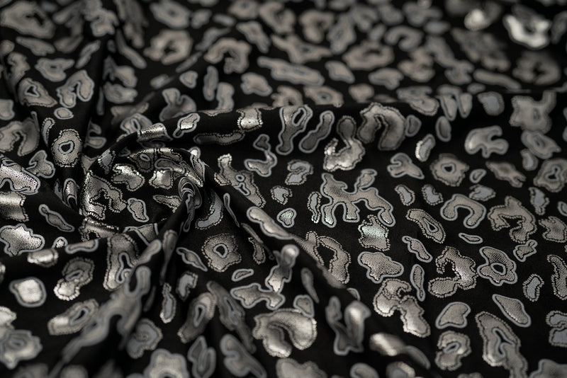 Detailed shot of Leo Party Foil Printed Spandex in color Black/Silver.