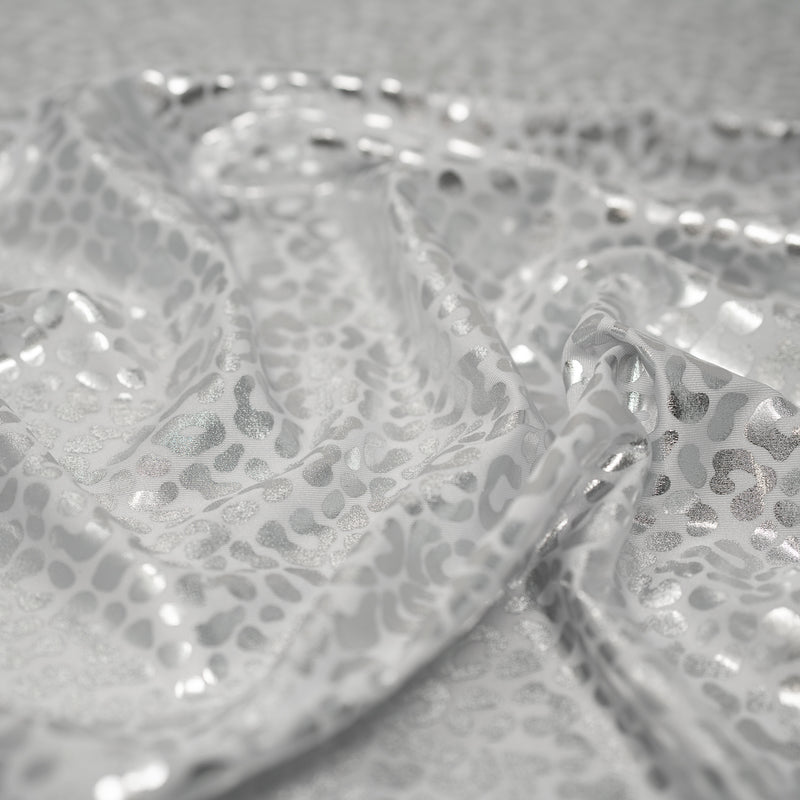 Detailed shot of Like Loud Leo Foiled Printed Spandex in White Silver.