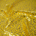 Detailed shot of Loud Leo Foil Printed Spandex in Yellow/Gold.