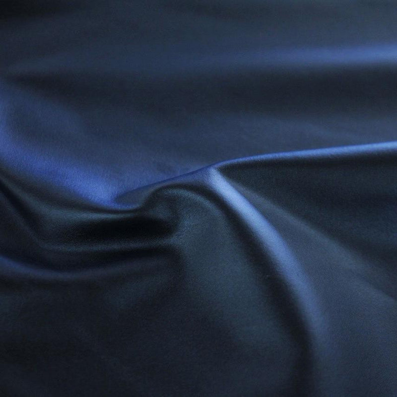 A swirled sample of luster soft foiled spandex in the color deep sea-blue.