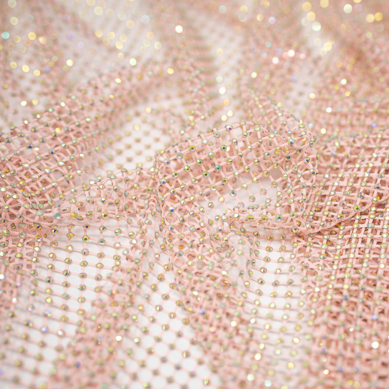 A crumpled piece of Enigma Diamond Fishnet in the color Baby-Pink-Rainbow