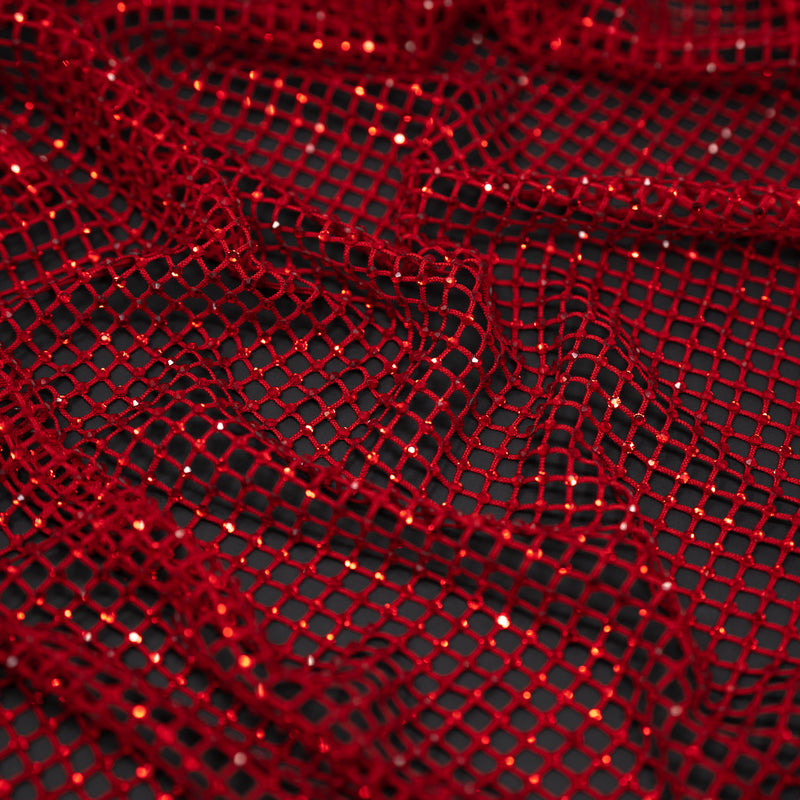 A crumpled piece of Enigma Diamond Fishnet in the color Red-Red