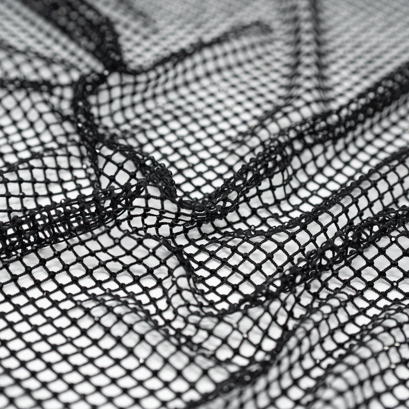A crumpled piece of Enigma Diamond Fishnet in the color Black