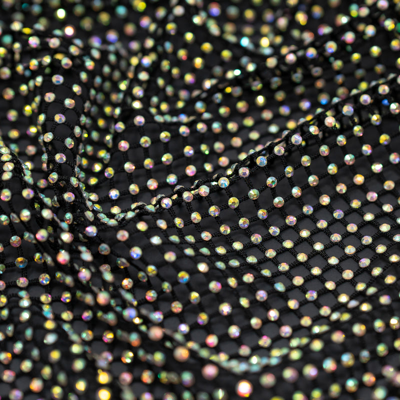 A crumpled piece of Enigma Diamond Fishnet in the color Black-Rainbow