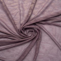 A swirled piece of Majestic Foiled Textured Stretch Mesh in the color Mauve-Gold