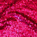 A swirled sample of marilyn stretch meh sequin in the color fuchsia.