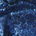 A swirled sample of marilyn stretch meh sequin in the color navy.