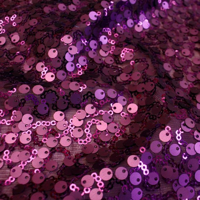 A swirled sample of marilyn stretch meh sequin in the color plum.