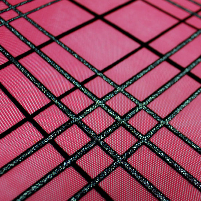 A flat sample of mary jane glitter stretch mesh in the color fuchsia-black-silver.
