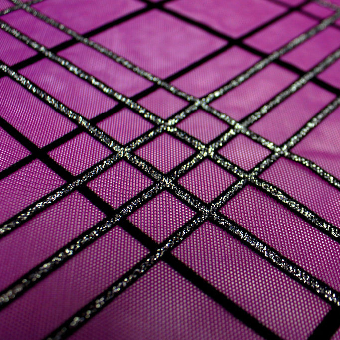A flat sample of mary jane glitter stretch mesh in the color purple-black-silver.