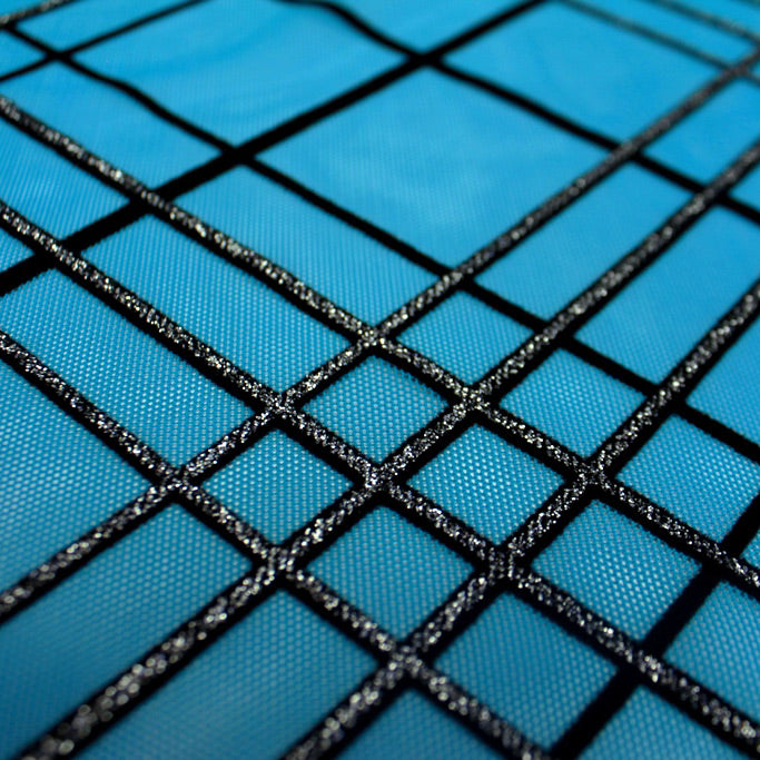 A flat sample of mary jane glitter stretch mesh in the color turquoise-black-silver.