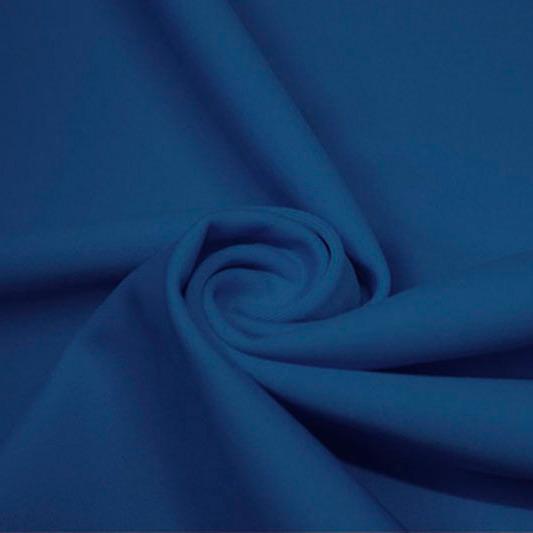 A swirled piece of matte nylon spandex fabric in the color abyss blue.