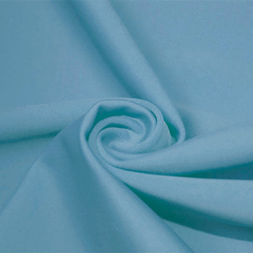 A swirled piece of matte nylon spandex fabric in the color bouquet blue.