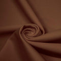 A swirled piece of matte nylon spandex fabric in the color chocolate brown.