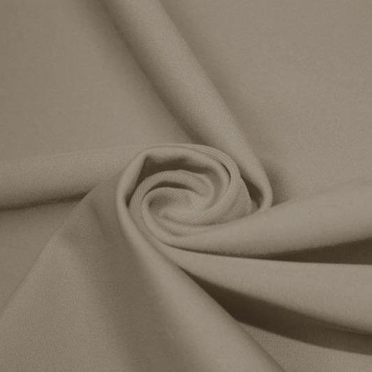 A swirled piece of matte nylon spandex fabric in the color dust.