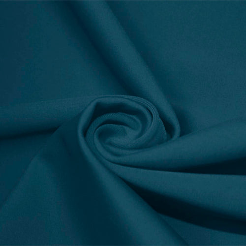 A swirled piece of matte nylon spandex fabric in the color empathy