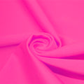 A swirled piece of matte nylon spandex fabric in the color famous.