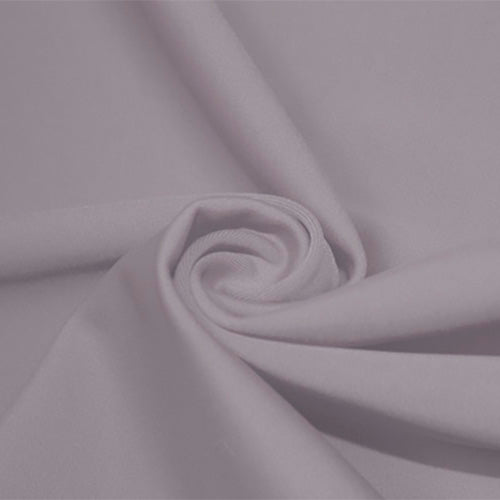 A swirled piece of matte nylon spandex fabric in the color Grape-Mist