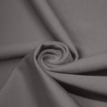 A swirled piece of matte nylon spandex fabric in the color gray.