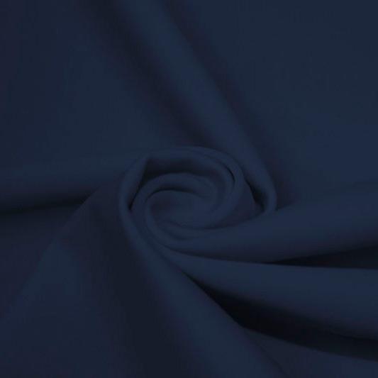 A swirled piece of matte nylon spandex fabric in the color marine navy.