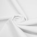 A swirled piece of matte nylon spandex fabric in the color martini white.