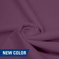 A swirled piece of matte nylon spandex fabric in the color melody.