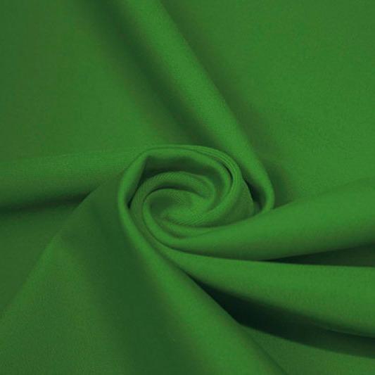 A swirled piece of matte nylon spandex fabric in the color moss.
