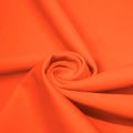 A swirled piece of matte nylon spandex fabric in the color nemo.