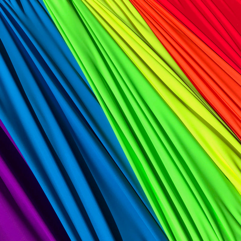 Samples of matte nylon spandex in neon colors sold at blue moon fabrics.